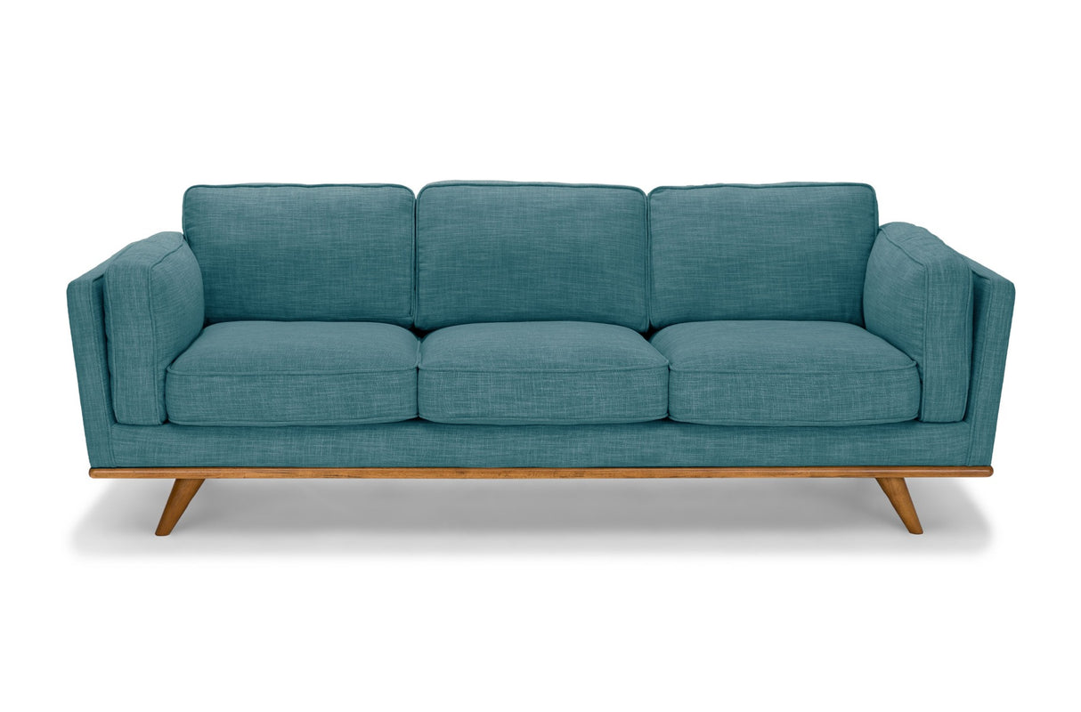 Marbella teal fabric sofa in a modern living room