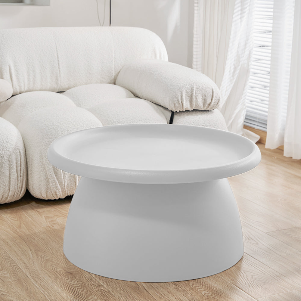Millgrove white plastic coffee table in a modern living room