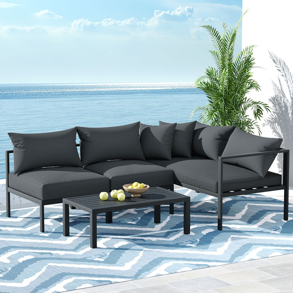Coolangatta charcoal aluminium outdoor sofa set in an outdoor setting