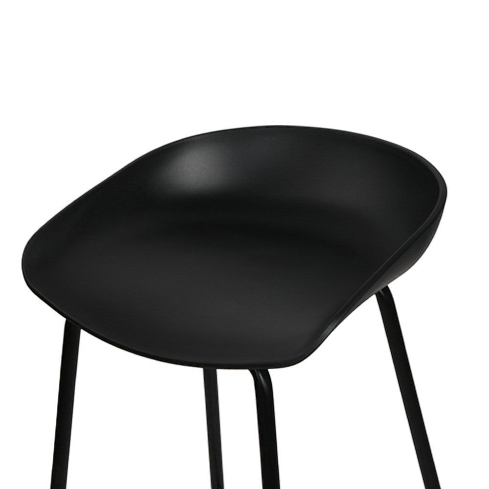 Carrum black metal bar stool with moulded seat in a minimalist kitchen