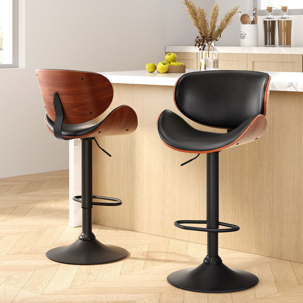 Carrum Downs black gas lift bar stool with padded leather seat at a kitchen counter