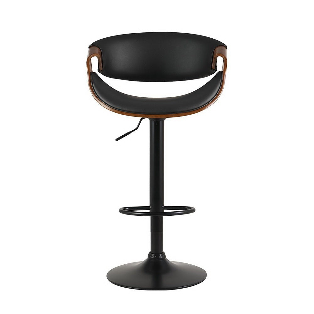 Tenby Point black gas lift swivel bar stool with curved backrest in a modern kitchen