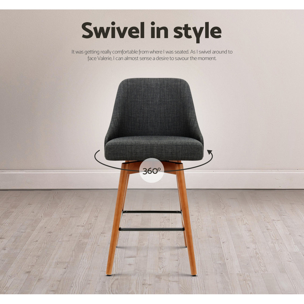 Four Artiss charcoal swivel bar stools in styled kitchen setting — Allure Home Collections