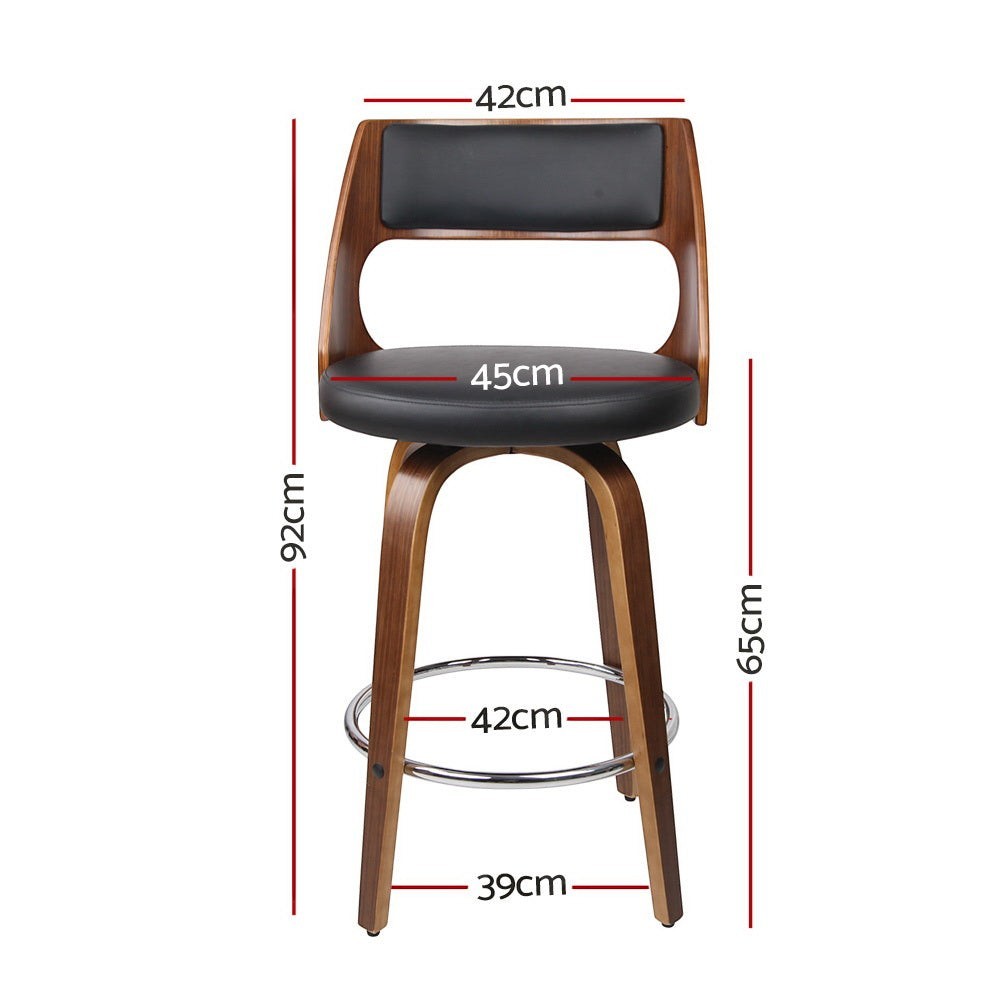 Highett black swivel faux leather bar stool with walnut legs in a modern kitchen