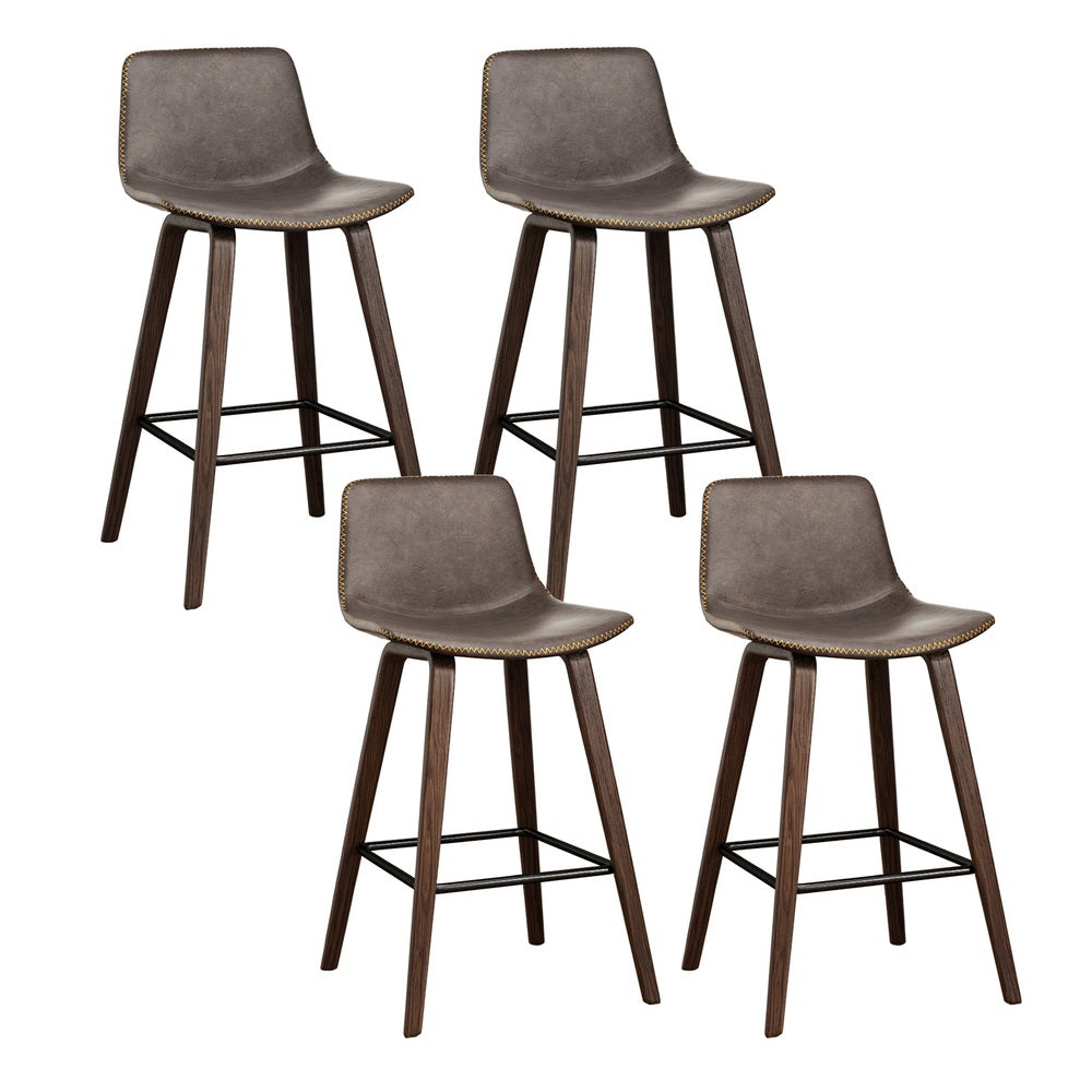 Devilbend walnut wooden bar stool with faux leather seat in a warm kitchen