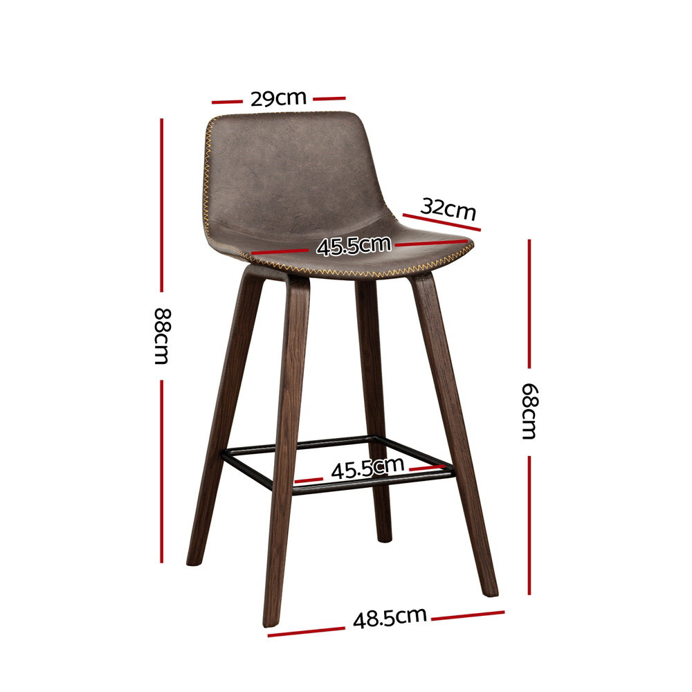 Devilbend walnut wooden bar stool with faux leather seat in a warm kitchen