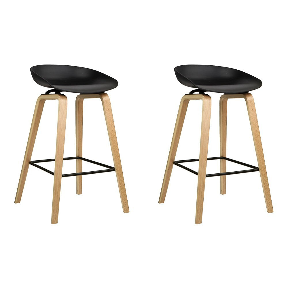 London Bridge black wooden bar stool with moulded seat at a kitchen counter