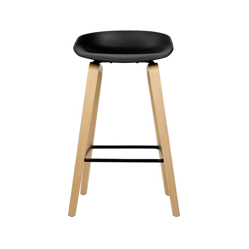 London Bridge black wooden bar stool with moulded seat at a kitchen counter