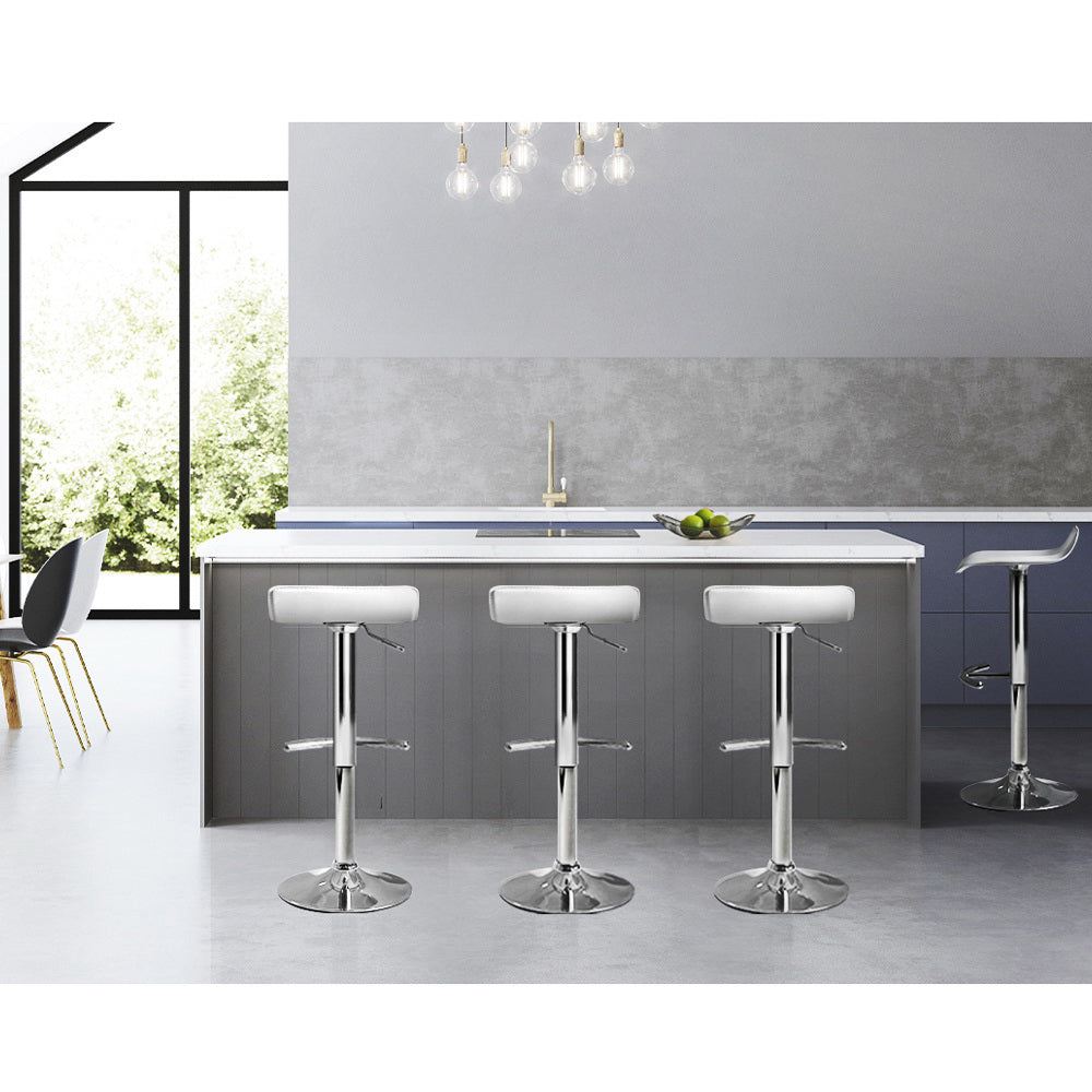 Four Artiss white adjustable bar stools in contemporary kitchen — Allure Home Collections