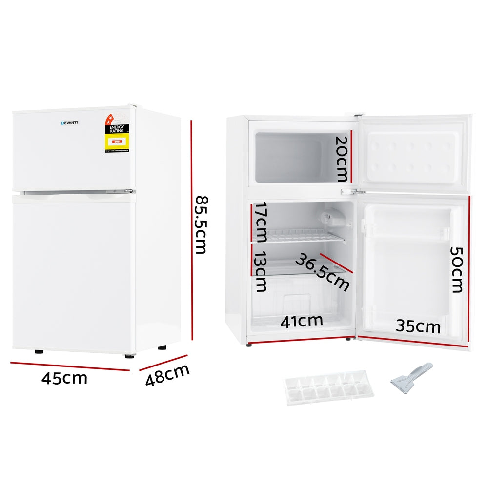 85 L white bar fridge shown at an angle with door closed