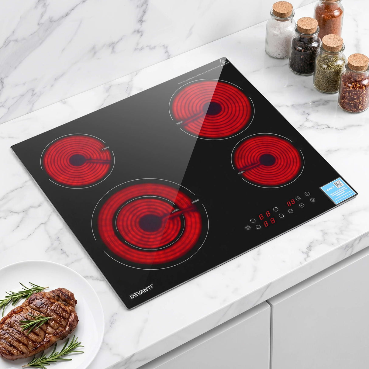 Black ceramic cooktop with four burners, top down view