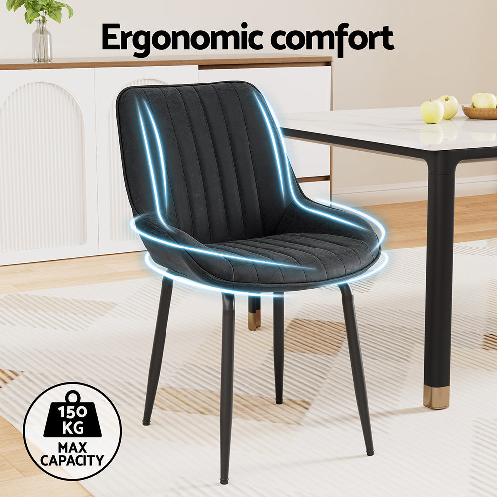 Nain black faux leather dining chair with metal legs in a modern dining room