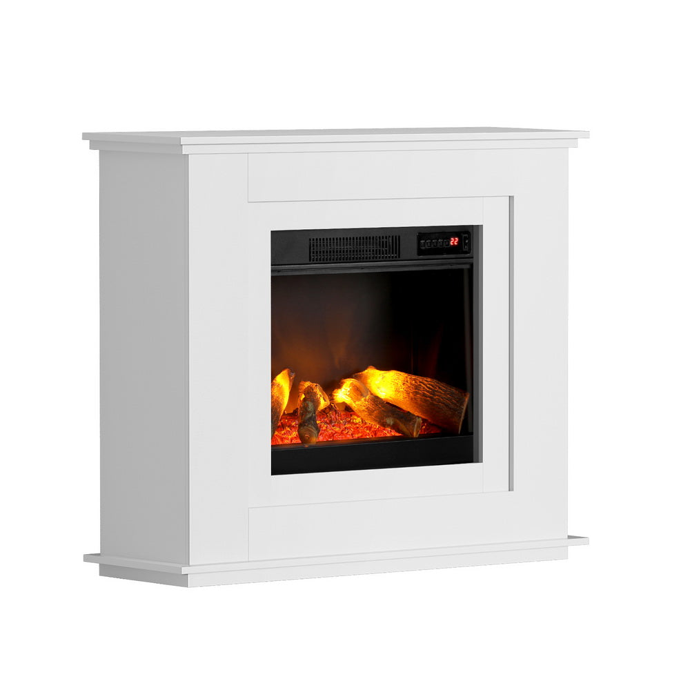 White electric mantel fireplace against a living room wall
