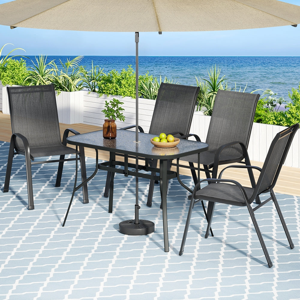 Five piece outdoor dining set with 120cm glass table and four black Textilene chairs