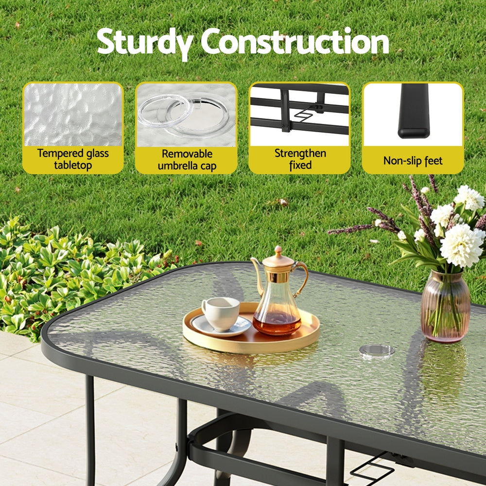 Five piece outdoor dining set with 120cm glass table and four grey Textilene chairs