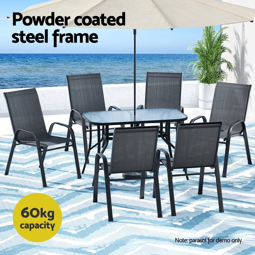 Seven piece outdoor dining set with glass table and six black Textilene chairs