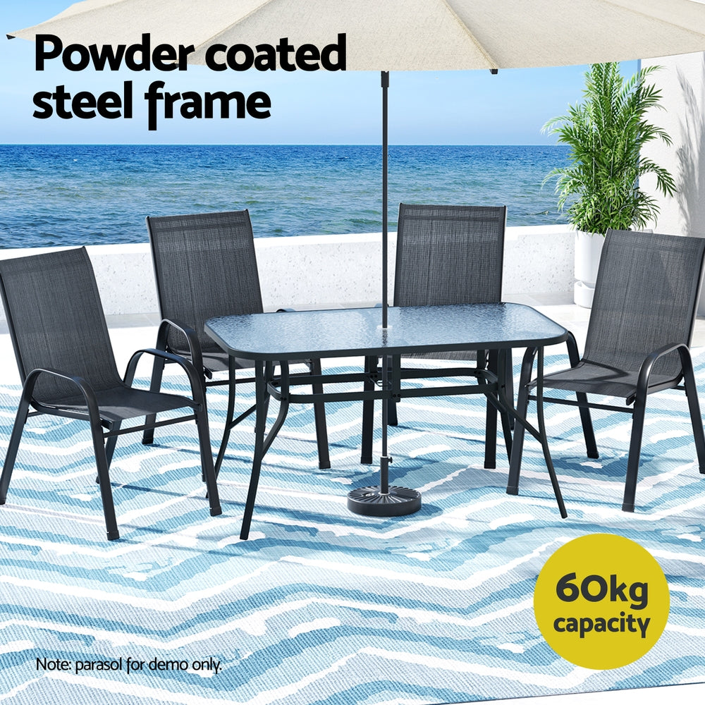 Five piece outdoor dining set with glass table and four black Textilene chairs