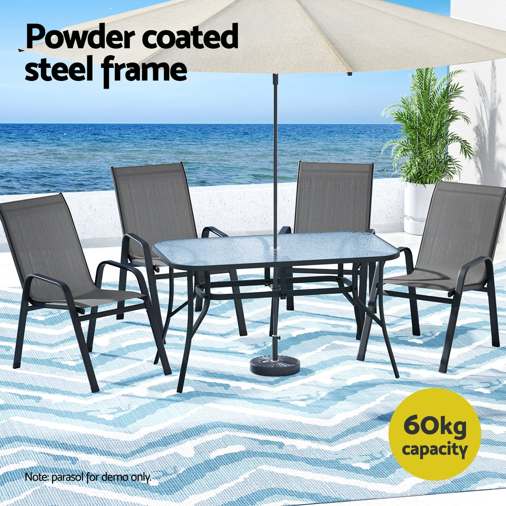 Five piece outdoor dining set with glass table and four grey Textilene chairs