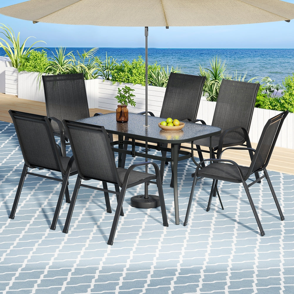 Black seven piece glass and textilene outdoor dining set
