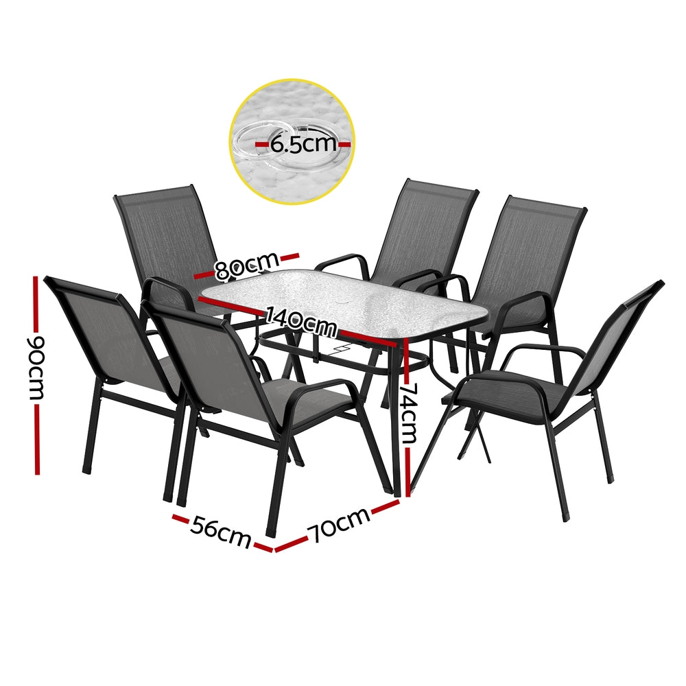 Seven piece outdoor dining set with glass table and six grey Textilene chairs