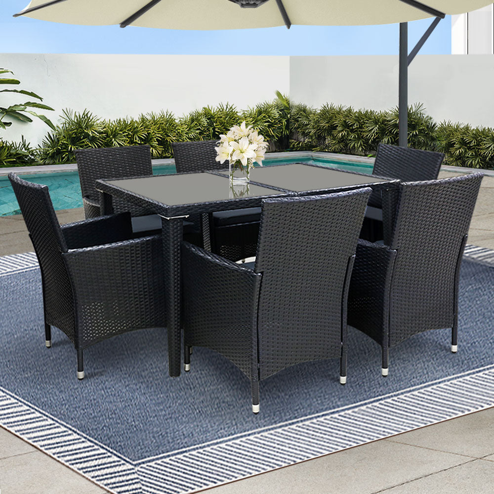Bargara black wicker outdoor dining set in an outdoor setting