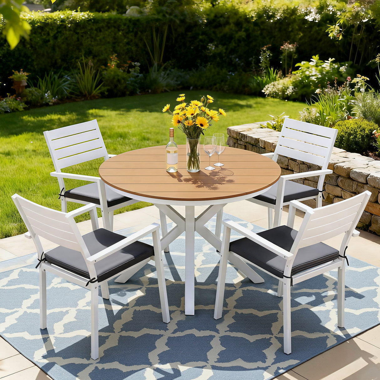 5 piece aluminium outdoor dining set with WPC tabletop and four white cushioned chairs