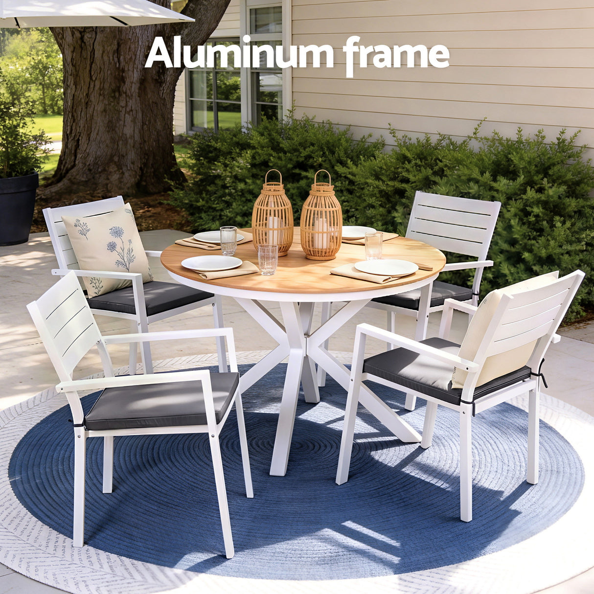 Five piece aluminium patio dining set arranged outdoors