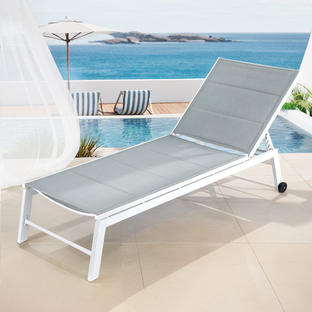 Ashmore white aluminium sun lounge in an outdoor setting