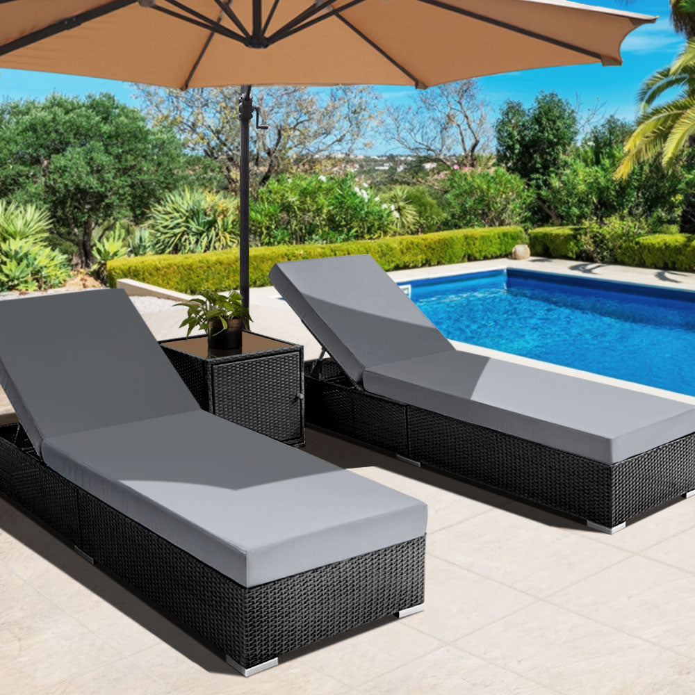 Bundaberg black wicker sun lounge set in an outdoor setting