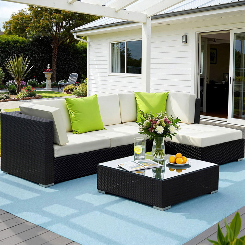 Hervey Bay black wicker outdoor corner lounge set in an outdoor setting