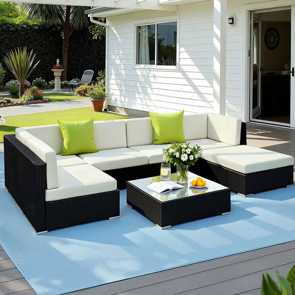 Hervey Bay black wicker outdoor corner lounge set in an outdoor setting