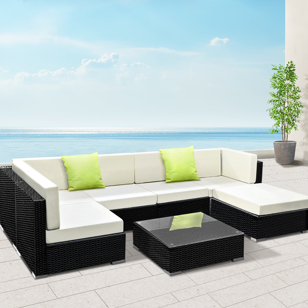 Hervey Bay black wicker outdoor corner lounge set in an outdoor setting