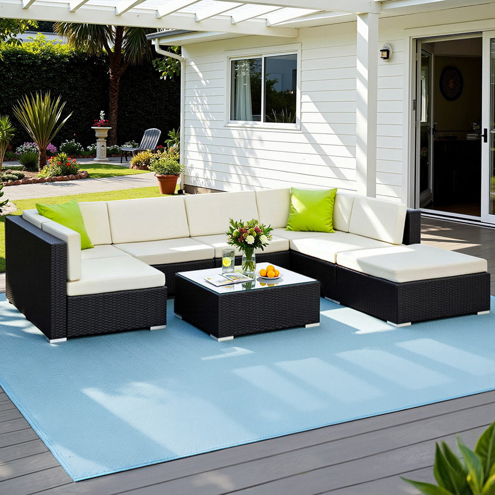 Hervey Bay black wicker outdoor corner lounge set in an outdoor setting