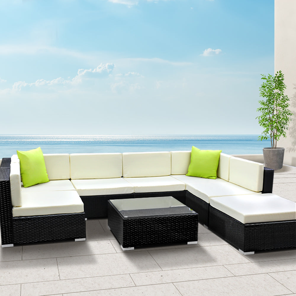 Hervey Bay black wicker outdoor corner lounge set in an outdoor setting