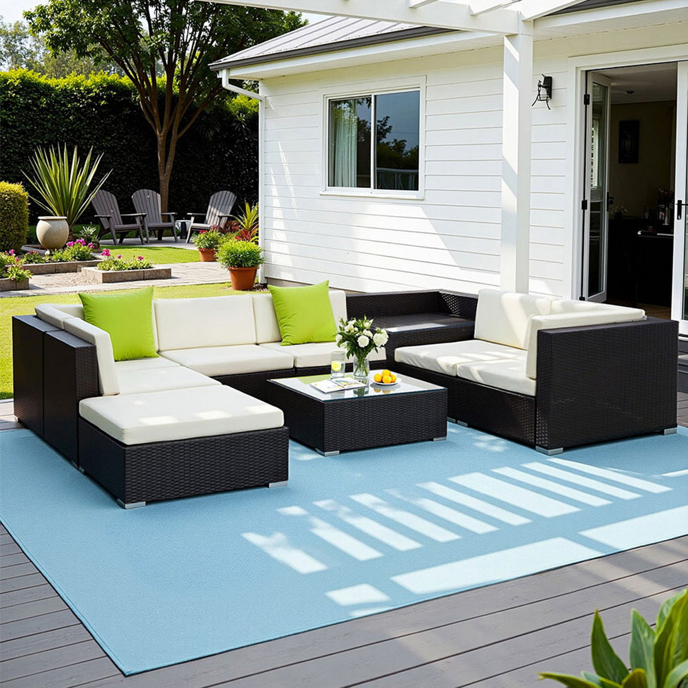 Hervey Bay black wicker outdoor corner lounge set in an outdoor setting