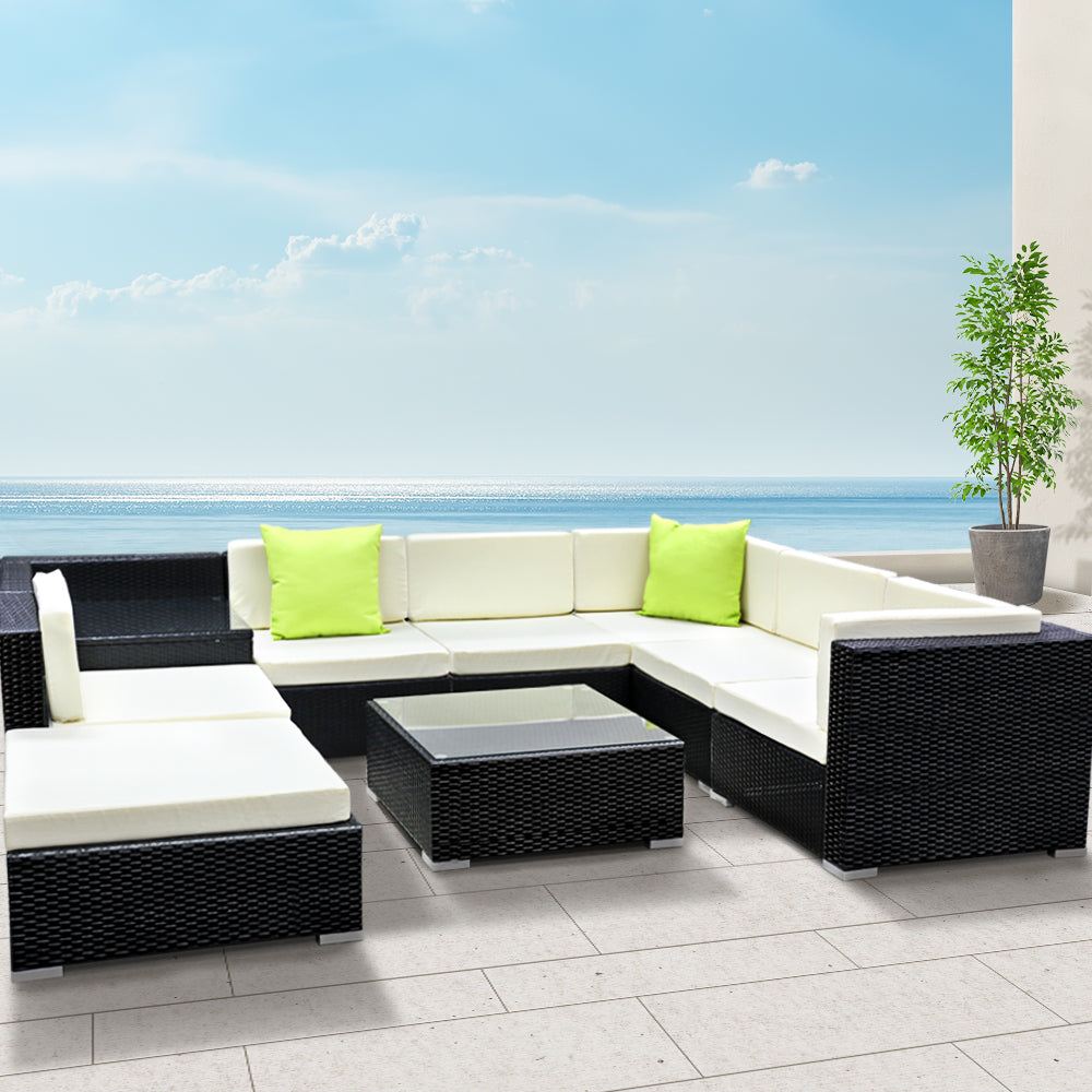 Hervey Bay black wicker outdoor corner lounge set in an outdoor setting