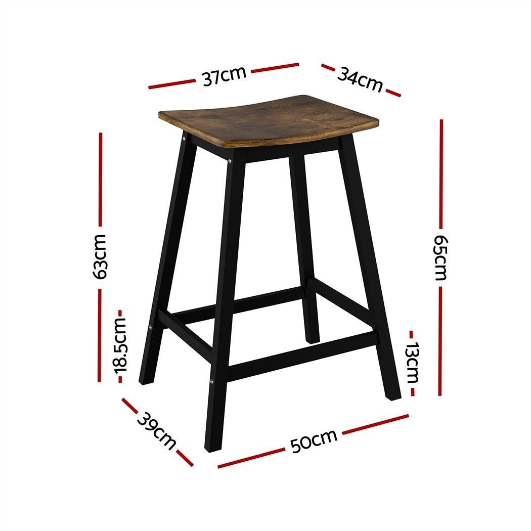 Edithvale rustic brown wooden bar stool with saddle seat in an industrial kitchen