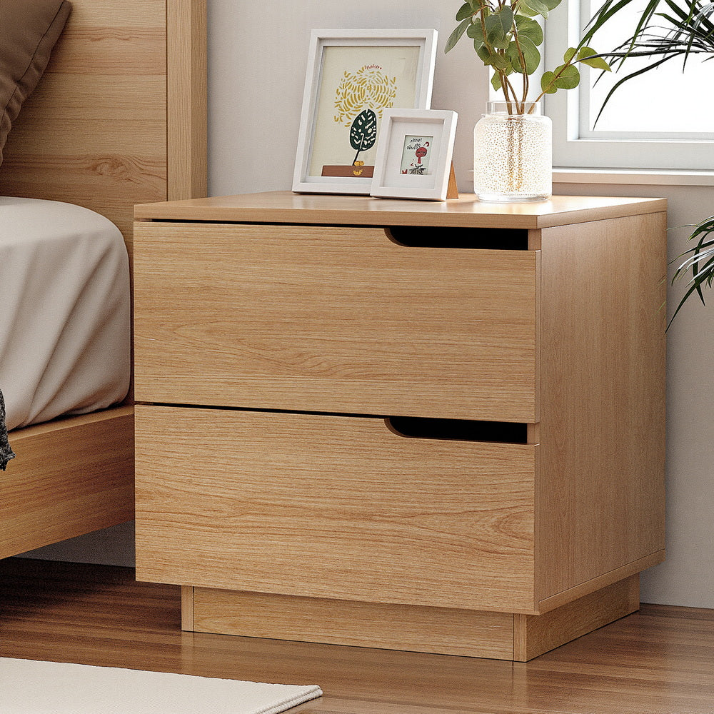 Newrybar pine two drawer bedside table with air gap handles in a contemporary bedroom