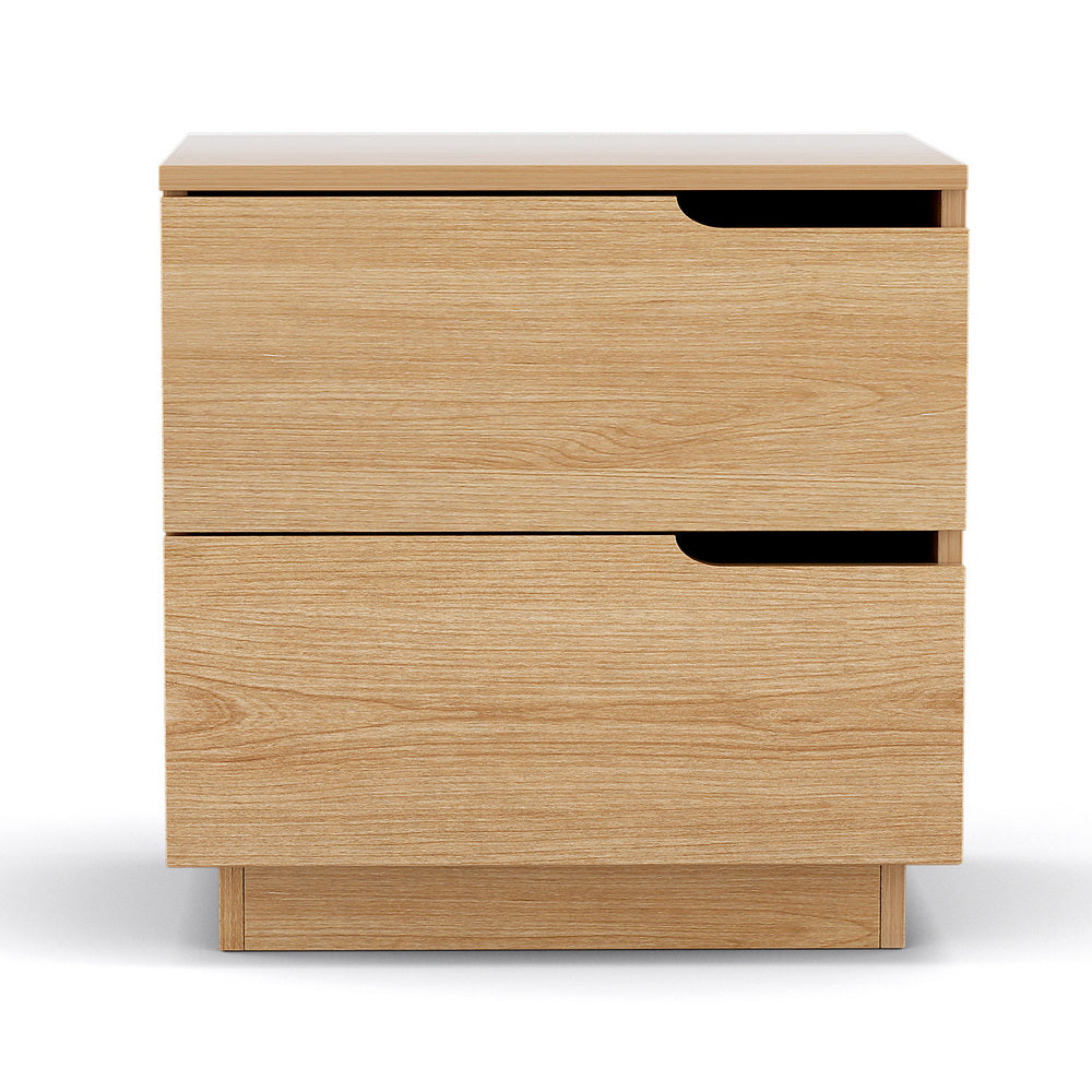 Newrybar pine two drawer bedside table with air gap handles in a contemporary bedroom