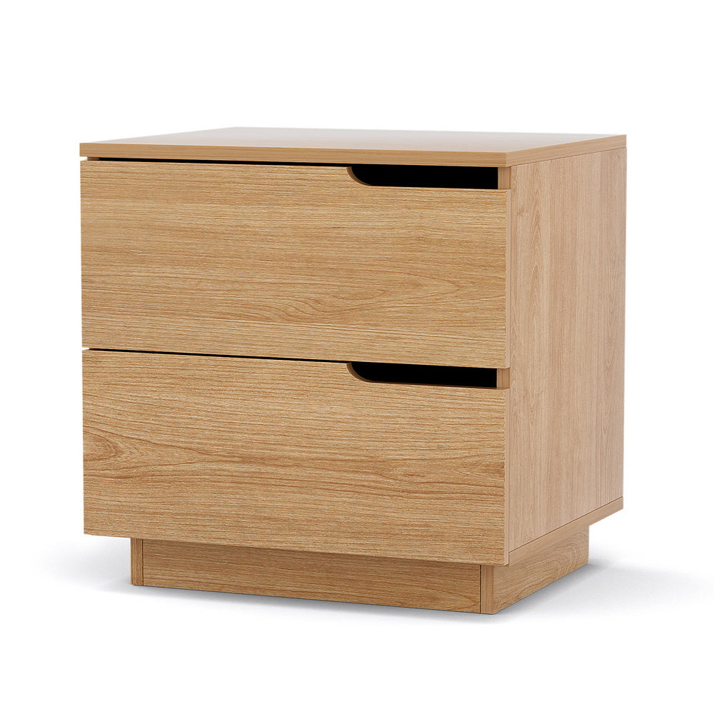 Newrybar pine two drawer bedside table with air gap handles in a contemporary bedroom