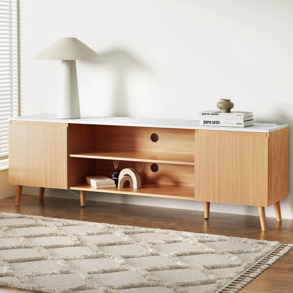 Swansea 180cm white entertainment unit with marble effect top and pine wood legs in a modern living room