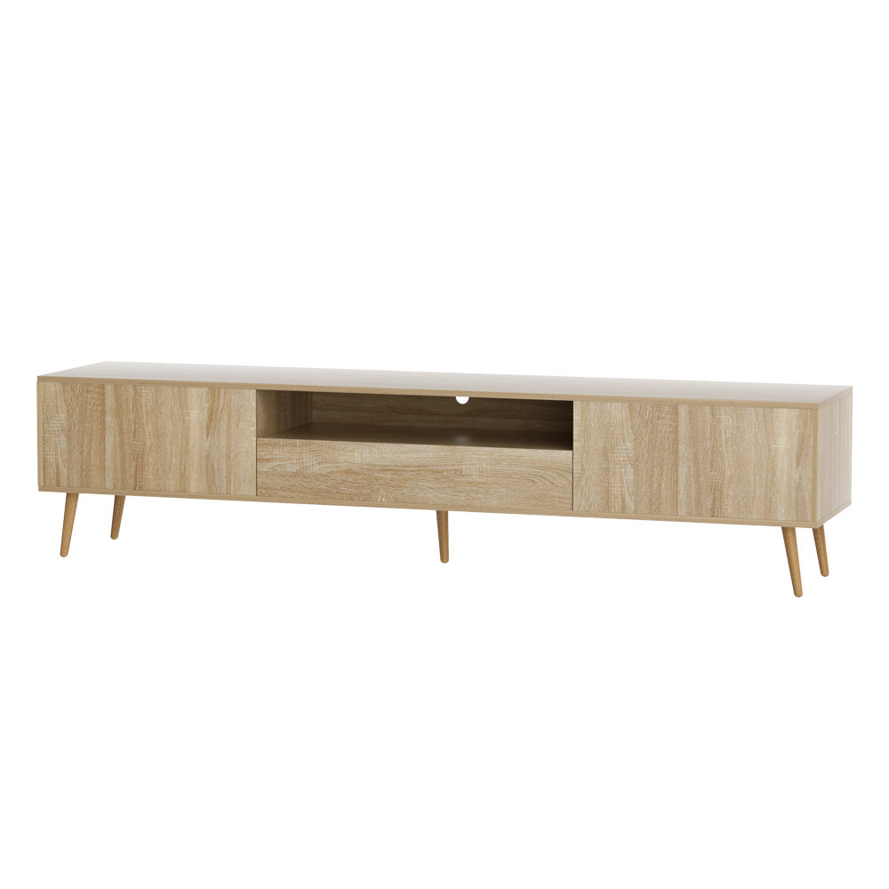 Woodbridge pine 200cm lowline entertainment unit with rubberwood legs in a modern living room