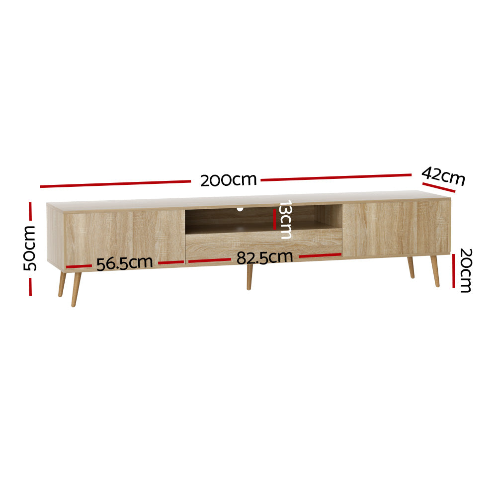 Woodbridge pine 200cm lowline entertainment unit with rubberwood legs in a modern living room