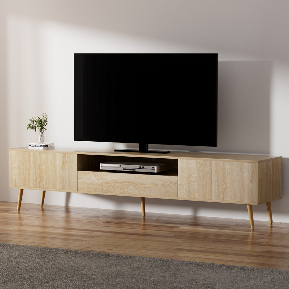 Woodbridge pine 200cm lowline entertainment unit with rubberwood legs in a modern living room