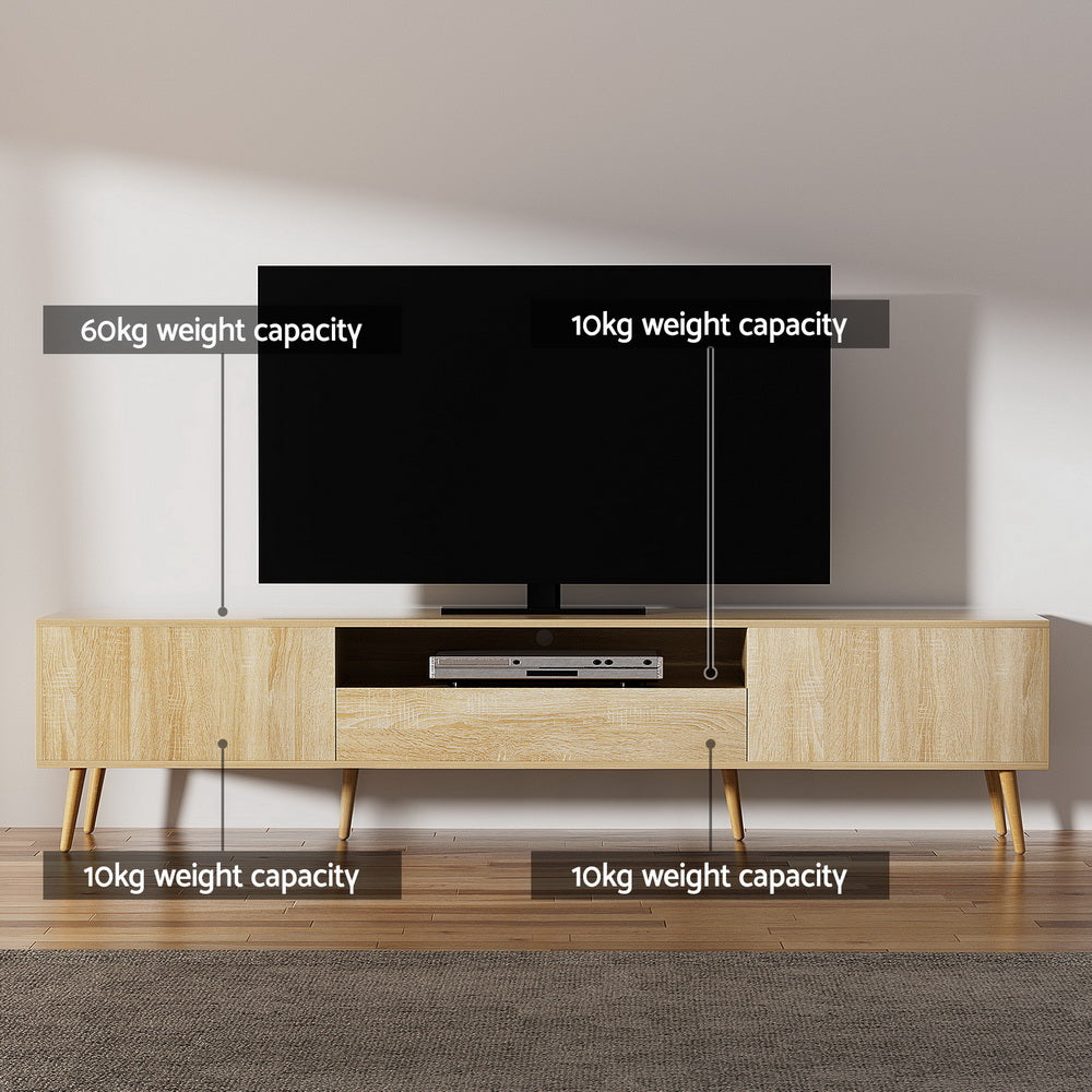 Woodbridge pine 200cm lowline entertainment unit with rubberwood legs in a modern living room