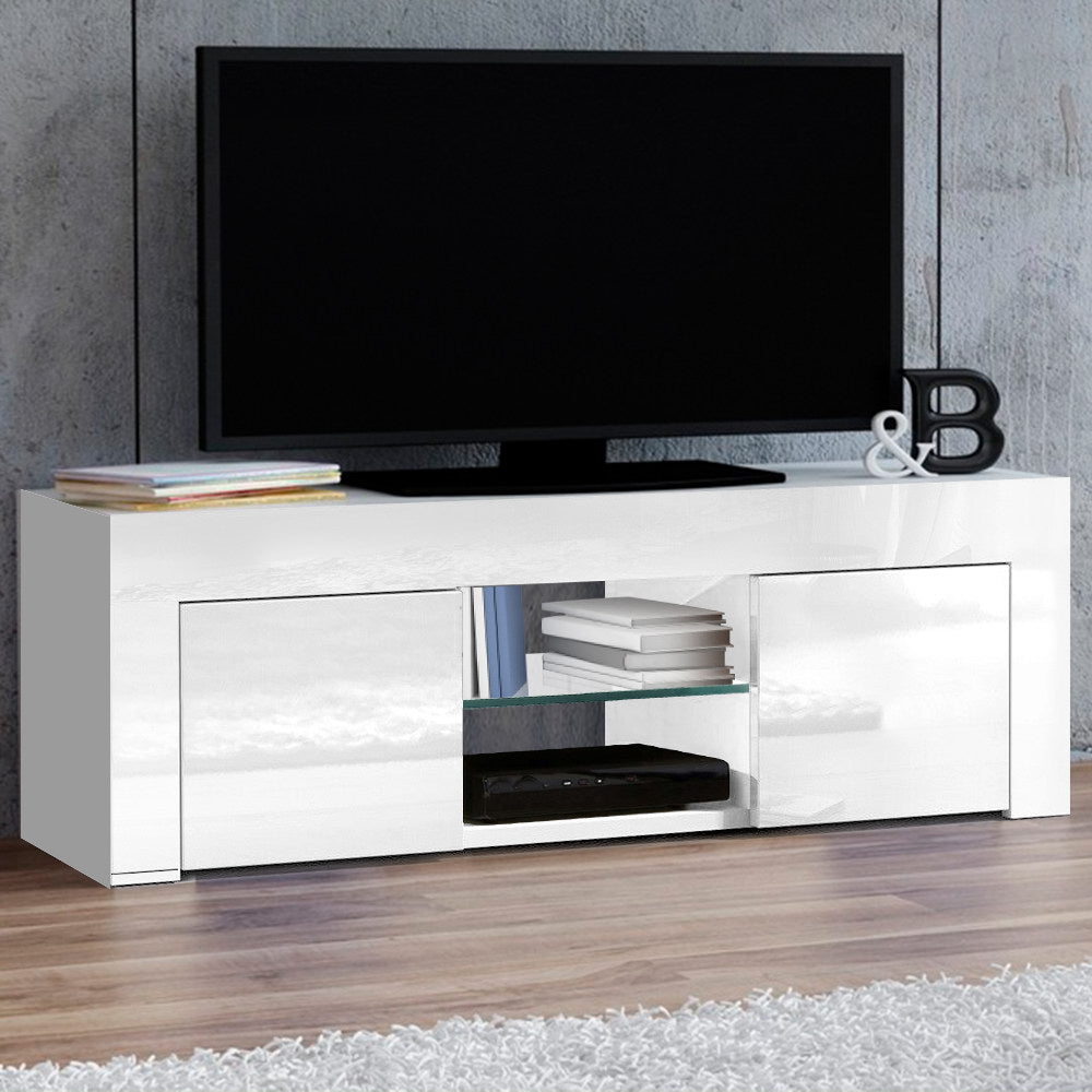 Southport white 130cm high gloss entertainment unit with glass shelves in a modern living room
