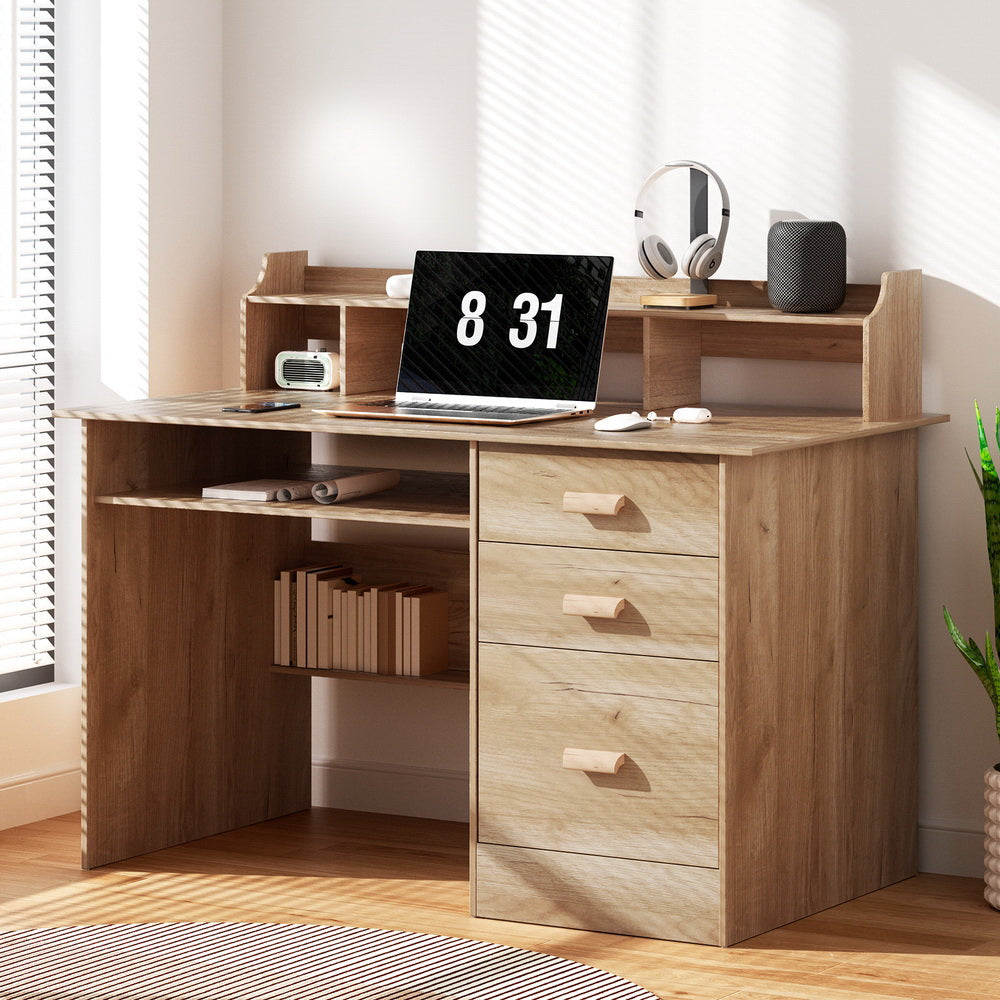 Acton pine computer desk with shelves and drawers in a home office