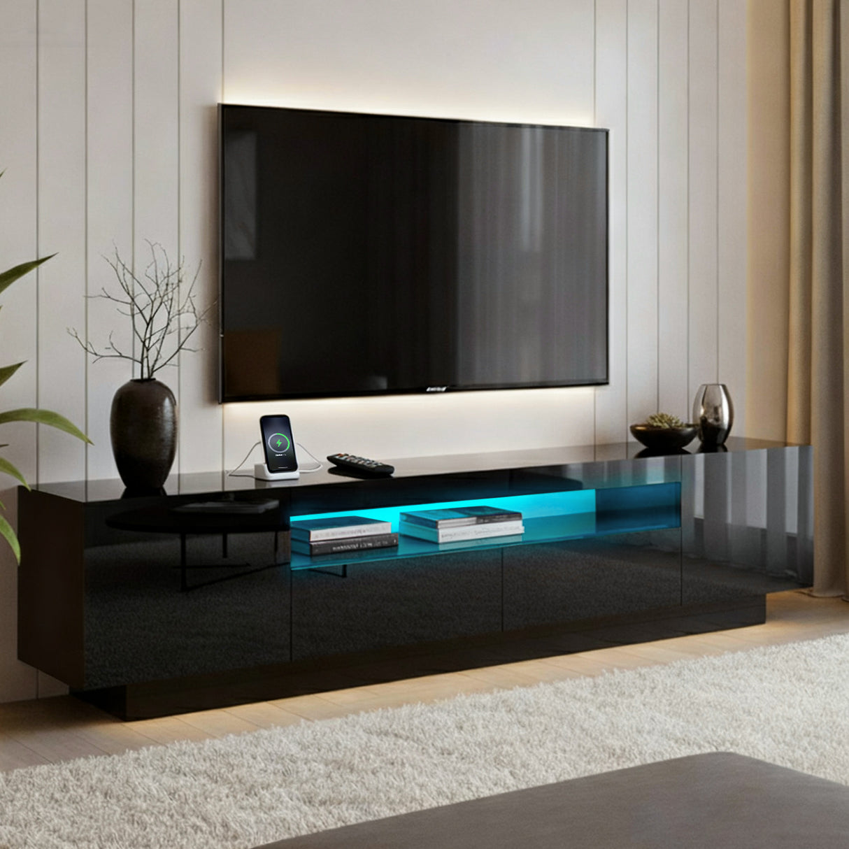 Launceston black high gloss LED entertainment unit with colour changing lighting in a modern living room