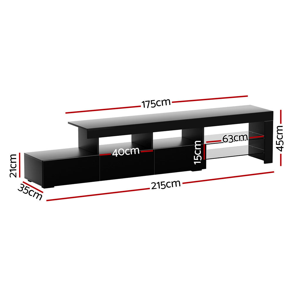 Penguin 215cm black LED entertainment unit with colour changing lighting and glass shelves in a modern living room