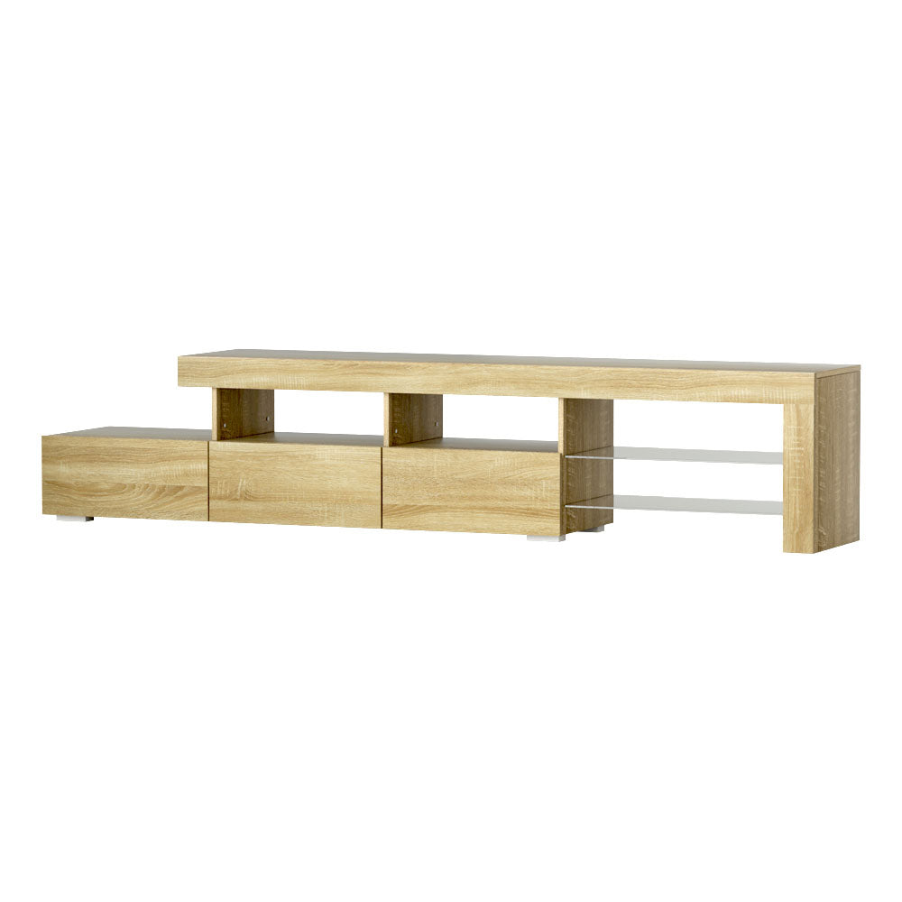 Penguin 215cm pine LED entertainment unit with colour changing lighting and glass shelves in a modern living room